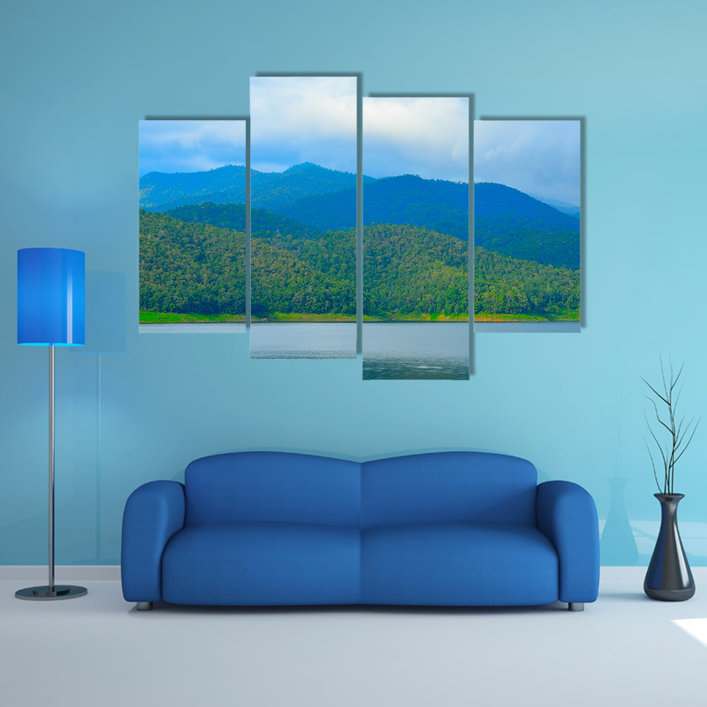 View of mountain forest landscape with heavy blue sky multi panel canvas wall art