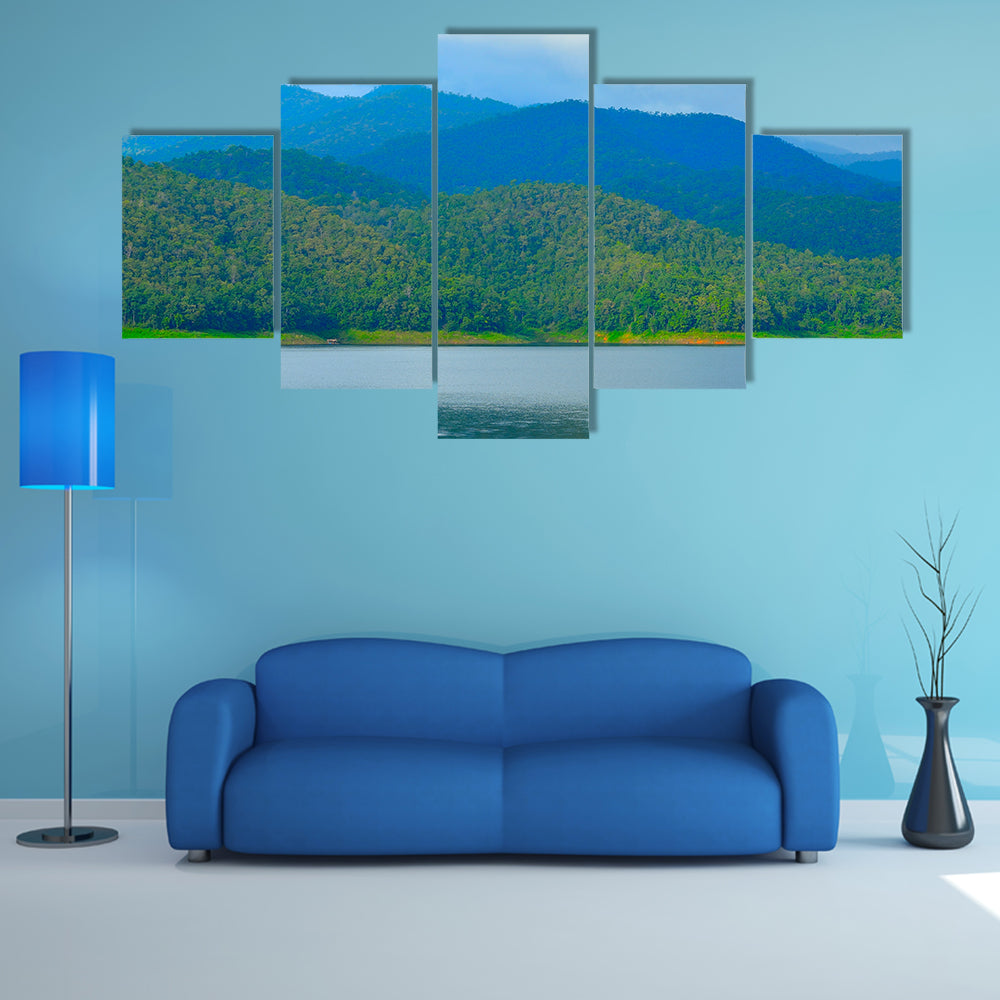 View of mountain forest landscape with heavy blue sky multi panel canvas wall art
