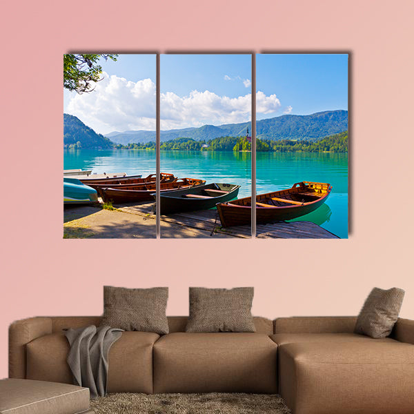 Landscape with boats at the pier of Bled Lake, on the Bled Island on the background Multi panel canvas wall art