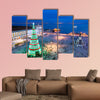 Christmas tree on Commerce square at twilight in Lisbon, Portugal multi panel canvas wall art