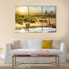 Dreamy scene of common South African safari wildlife animals together at sunset Multi panel canvas wall art