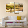 Dreamy scene of common South African safari wildlife animals together at sunset Multi panel canvas wall art