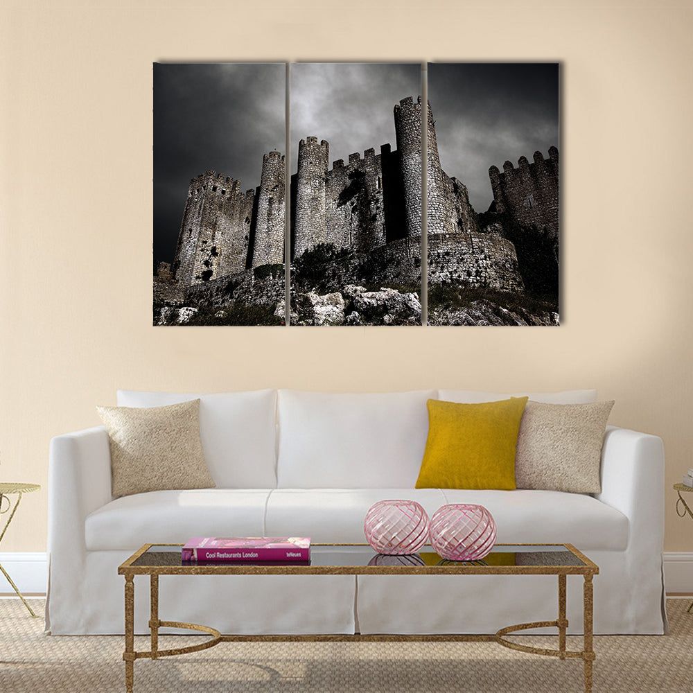Disturbing scene with medieval castle at night with stormy sky Multi Panel Canvas Wall Art