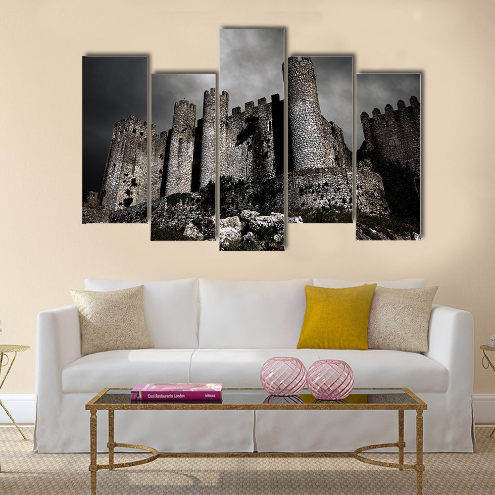 Disturbing scene with medieval castle at night with stormy sky Multi Panel Canvas Wall Art