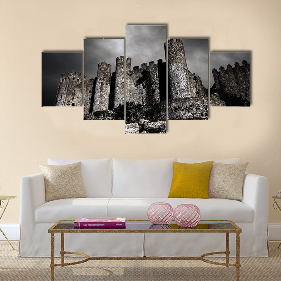 Disturbing scene with medieval castle at night with stormy sky Multi Panel Canvas Wall Art