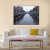 Along the canal walk citizens and moving vehicles Multi panel canvas wall art