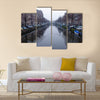 Along the canal walk citizens and moving vehicles Multi panel canvas wall art