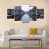 Along the canal walk citizens and moving vehicles Multi panel canvas wall art