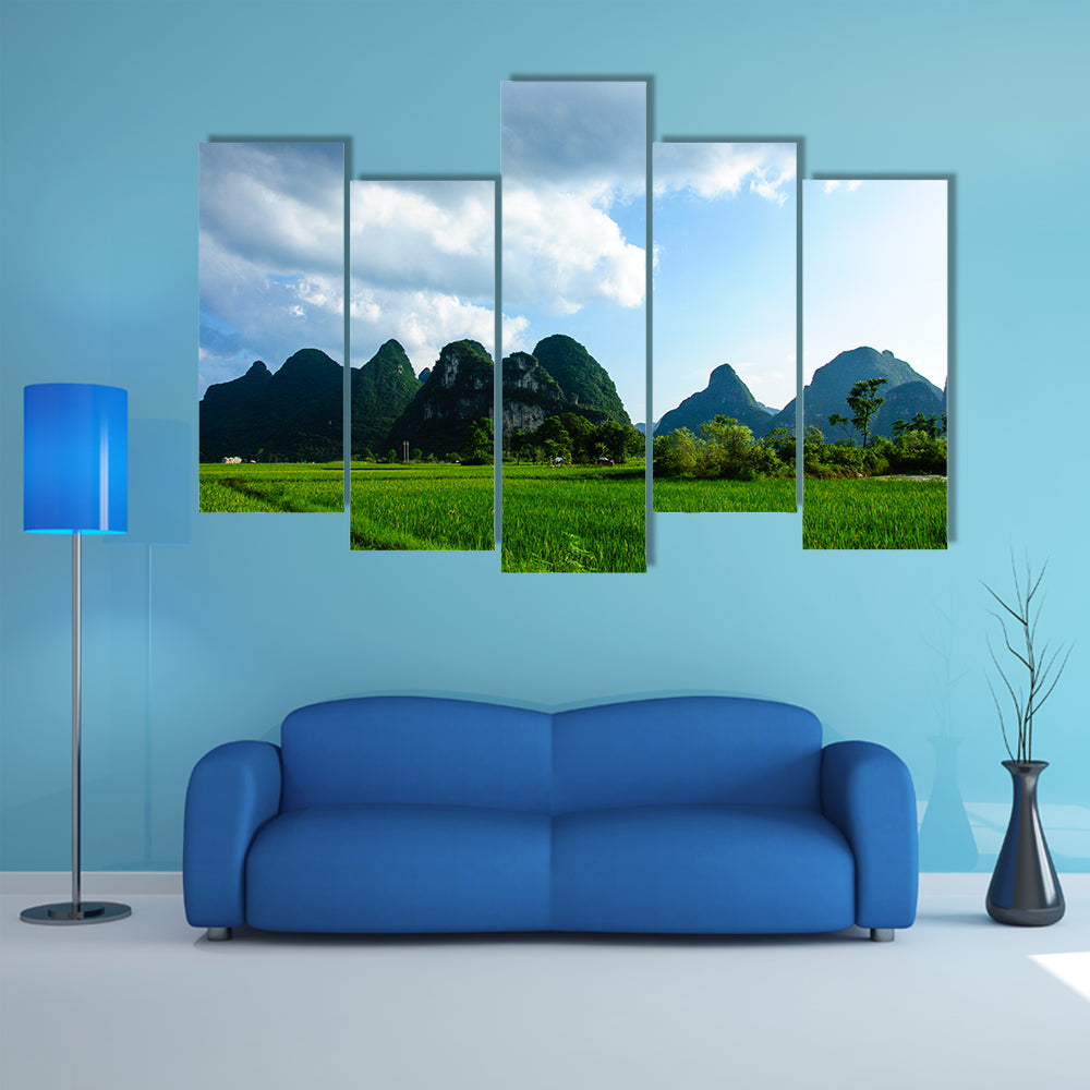 Karsts mountains and rural scenery in summer multi panel canvas wall art
