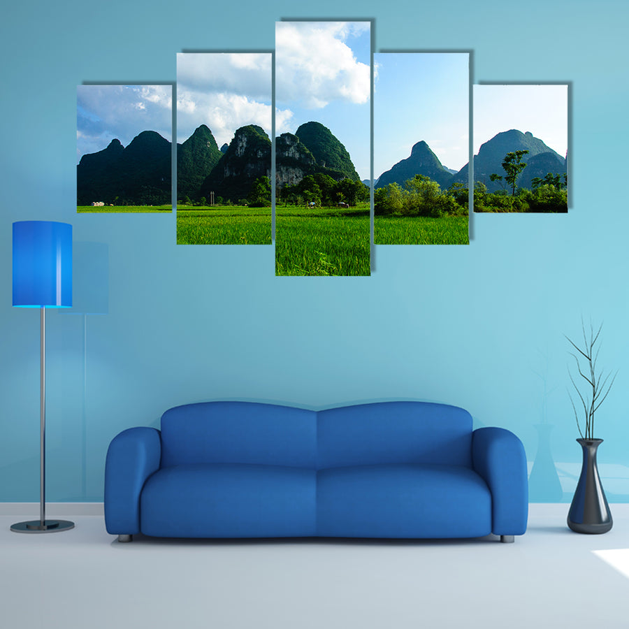Karsts mountains and rural scenery in summer multi panel canvas wall art