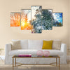 Sunlight breaks through the pine trees in winter. Multi panel canvas wall art