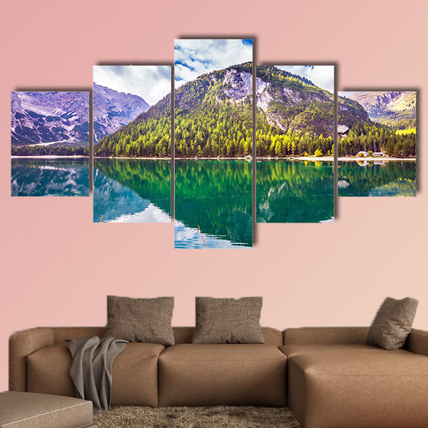 Emerald expanse of water reflects the surrounding canvas wall art