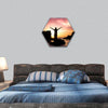 Woman silhouette relaxing at the sunset hexagonal canvas wall art