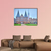 Holsten gate of Lubeck in Germany, City Gate at dawn wall art