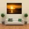 The Reflection Of The Sunlight Over A Lake Along With Clouds Multi Panel Canvas Wall Art