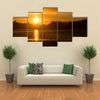 The Reflection Of The Sunlight Over A Lake Along With Clouds Multi Panel Canvas Wall Art