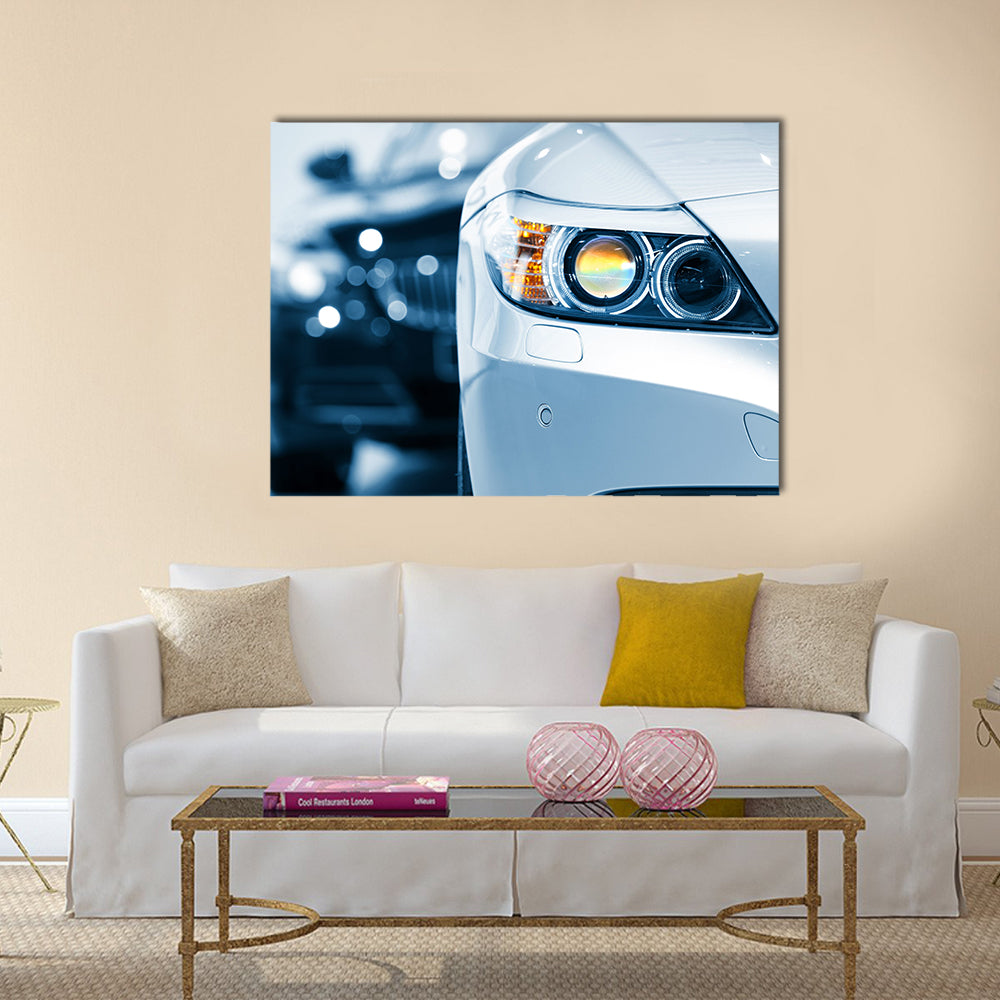 Close up shot of car head lamp in blue color tone Multi panel canvas wall art