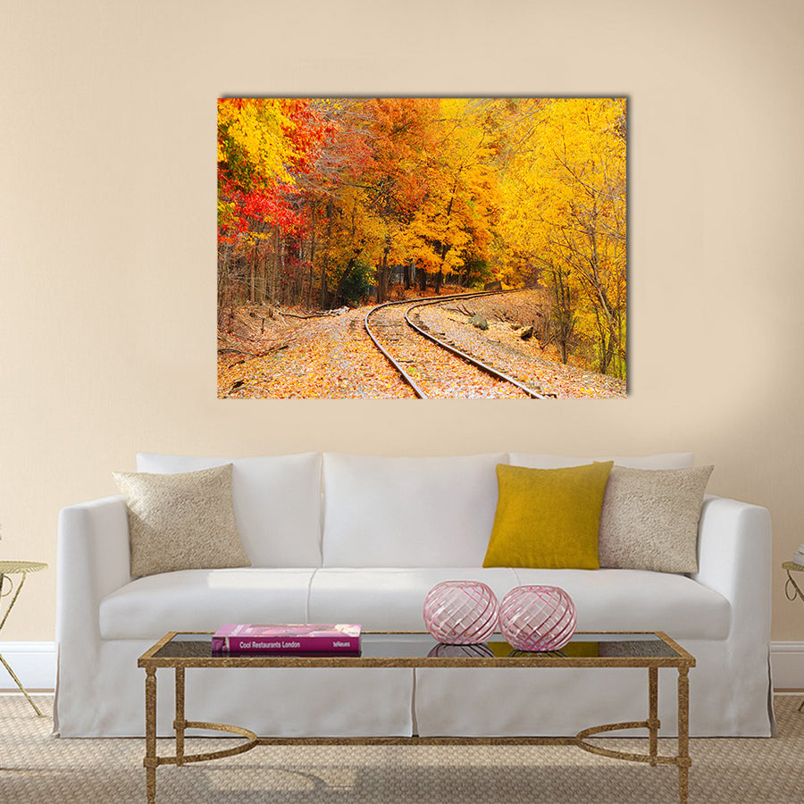 An old railroad track (still in use) runs through a brilliantly colored autumn woods Multi panel canvas wall art