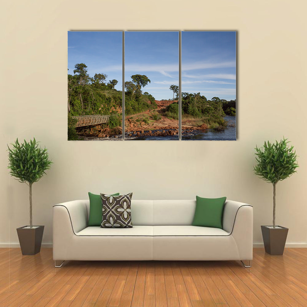 African river crossing the forest with ancient bridge Multi panel canvas wall art