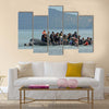 Refugee migrants, arrived on Lesvos in inflatable dinghy boats Multi Panel Canvas Wall Art