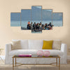 Refugee migrants, arrived on Lesvos in inflatable dinghy boats Multi Panel Canvas Wall Art