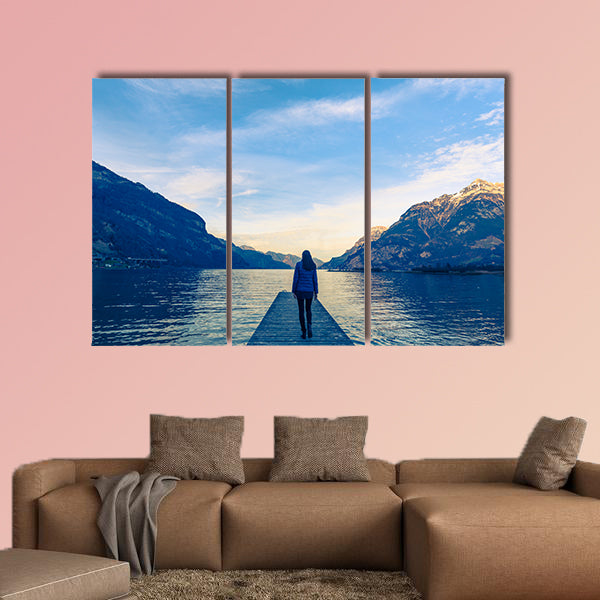 Woman goes on a wooden pier multi panel canvas wall art