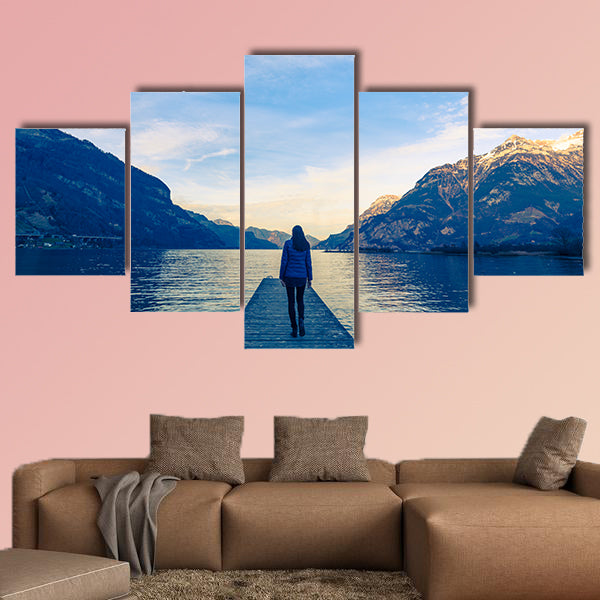 Woman goes on a wooden pier multi panel canvas wall art