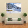 Chad with firewood in Austrian Alps during winter time Multi panel canvas wall art