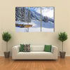 Chad with firewood in Austrian Alps during winter time Multi panel canvas wall art