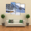 Chad with firewood in Austrian Alps during winter time Multi panel canvas wall art