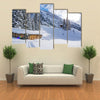 Chad with firewood in Austrian Alps during winter time Multi panel canvas wall art