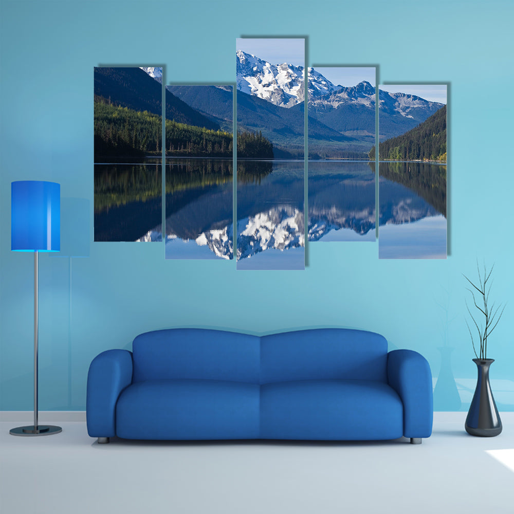 The mountain Range in British Columbia reflecting on a lake multi panel canvas wall art