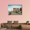 Cobbled street leading to legislative house in Hungary multi panel canvas wall art