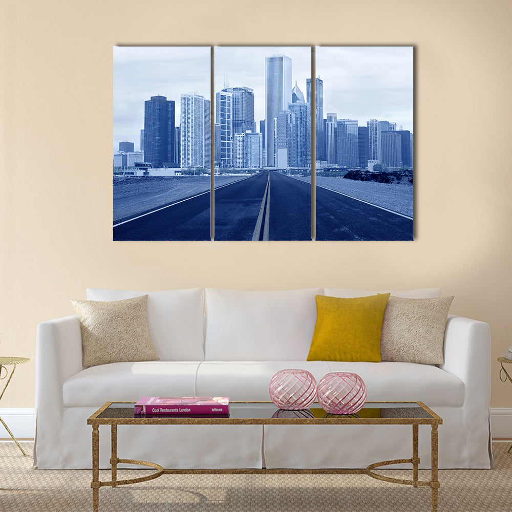 Road leading to a city multi panel canvas wall art