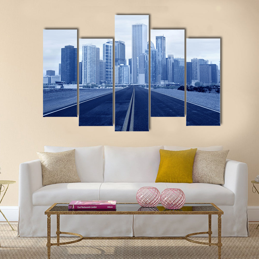 Road leading to a city multi panel canvas wall art