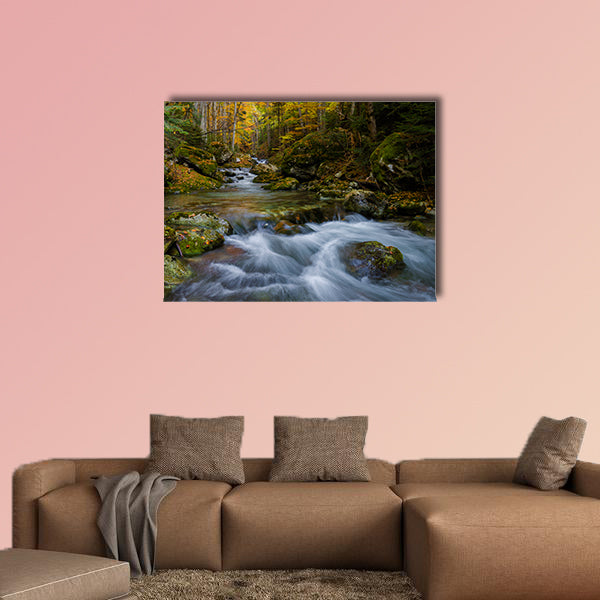 Magically colorful autumn in a wild old forest park with a pure stream cascading down the mountain Multi panel canvas wall art
