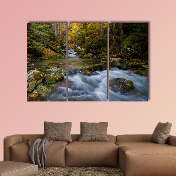 Magically colorful autumn in a wild old forest park with a pure stream cascading down the mountain Multi panel canvas wall art