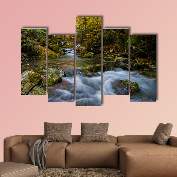 Magically colorful autumn in a wild old forest park with a pure stream cascading down the mountain Multi panel canvas wall art