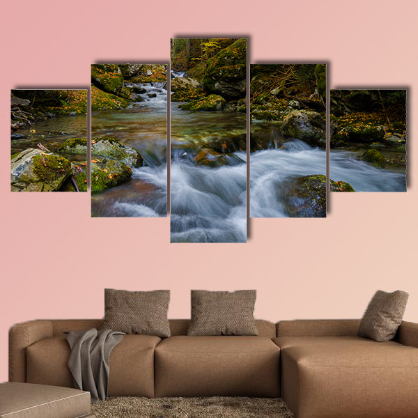 Magically colorful autumn in a wild old forest park with a pure stream cascading down the mountain Multi panel canvas wall art