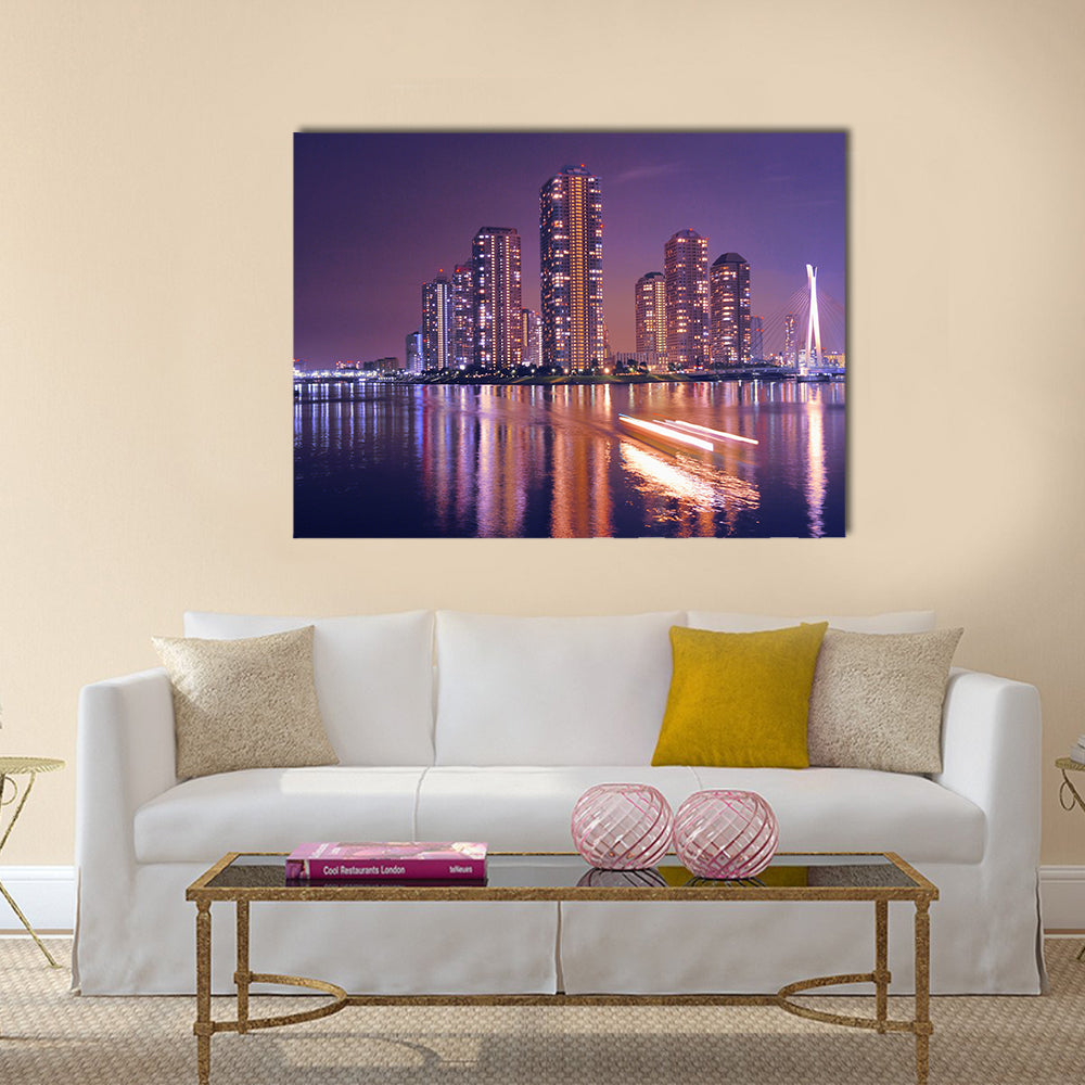 Modern Tokyo buildings with night reflection in water and light traces of moving ship, Japan Multi Panel Canvas Wall Art