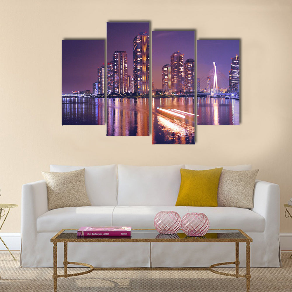 Modern Tokyo buildings with night reflection in water and light traces of moving ship, Japan Multi Panel Canvas Wall Art