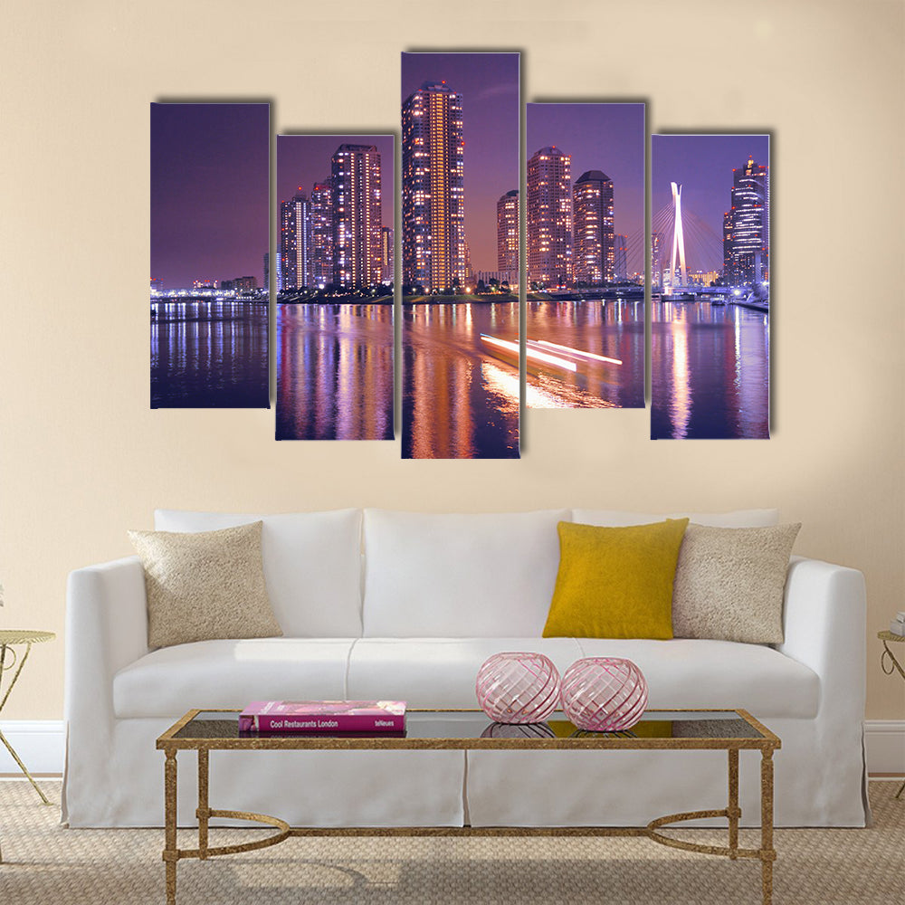 Modern Tokyo buildings with night reflection in water and light traces of moving ship, Japan Multi Panel Canvas Wall Art