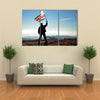 Successful silhouette man winner waving Suriname flag on top of the mountain peak Multi Panel Canvas Wall Art