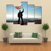 Successful silhouette man winner waving Suriname flag on top of the mountain peak Multi Panel Canvas Wall Art