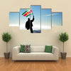 Successful silhouette man winner waving Suriname flag on top of the mountain peak Multi Panel Canvas Wall Art