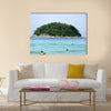 Island near the beach in the ocean Multi Panel Canvas Wall Art