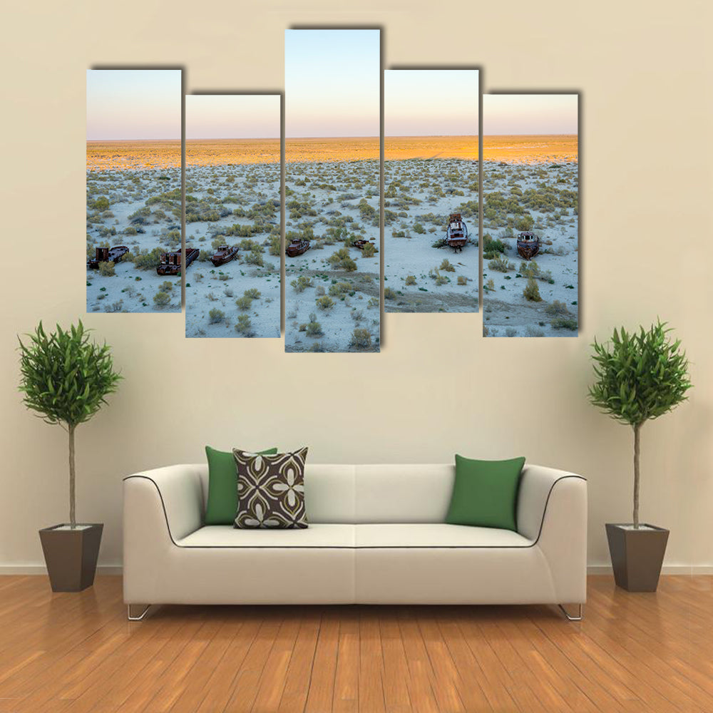 Old ships in the desert ship cemetery the consequence of Aral sea disaster Muynak Uzbekistan Multi panel canvas wall art