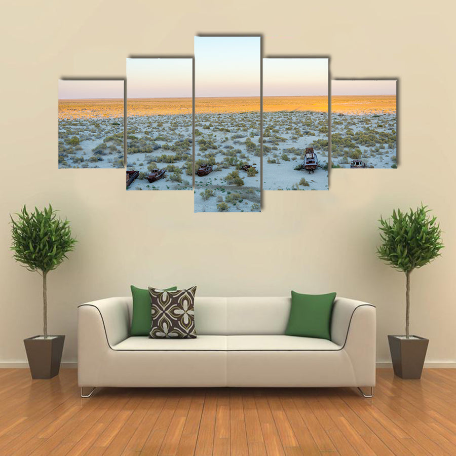 Old ships in the desert ship cemetery the consequence of Aral sea disaster Muynak Uzbekistan Multi panel canvas wall art