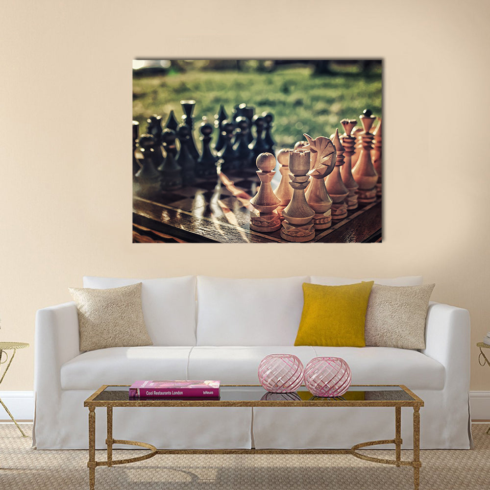 chess pieces arranged on the board mid-game in the fresh air multi panel canvas wall art
