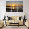 Spring sunset on the river, the sun in the reeds Multi panel canvas wall art